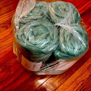 Four 4 spools of jumbo green Hilo roving yarn.